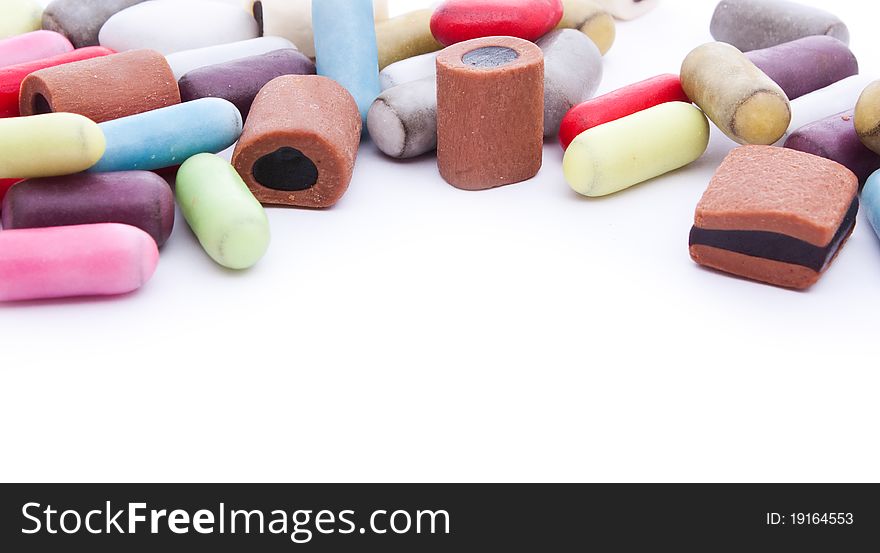 Close up shot of multicolored licorice on white background