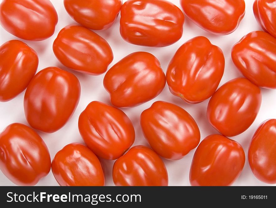 Red cherry tomatoes on the white background