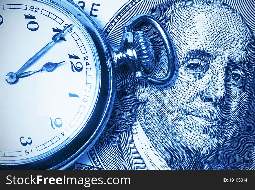 Old clock on the background of the portrait of Franklin at the hundred dollar bill. Old clock on the background of the portrait of Franklin at the hundred dollar bill