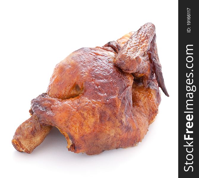 A half roasted chicken isolated on white background