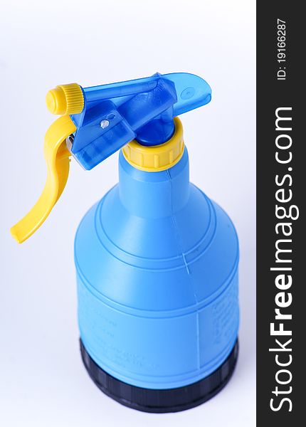 Blue bootle with sprayer isolated on the white background