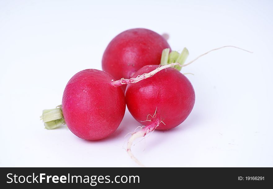 Same red radish for natural breakfast on white background