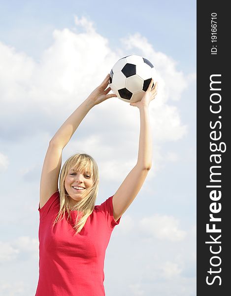 Beautiful young blond woman with soccer ball. Beautiful young blond woman with soccer ball