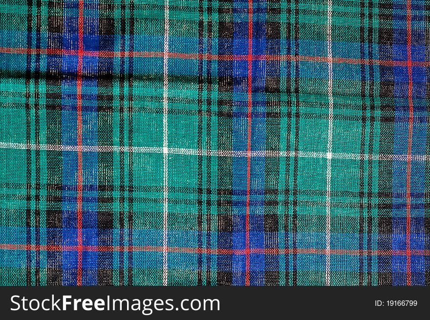 Close photo of squared colourful cloth, may be used as background. Close photo of squared colourful cloth, may be used as background