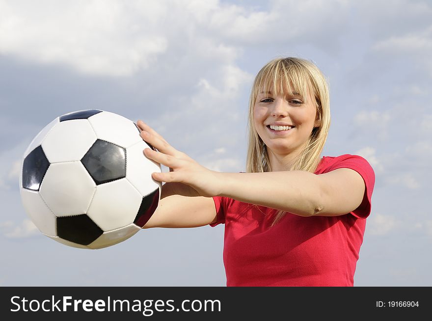 Young woman with soccer ball