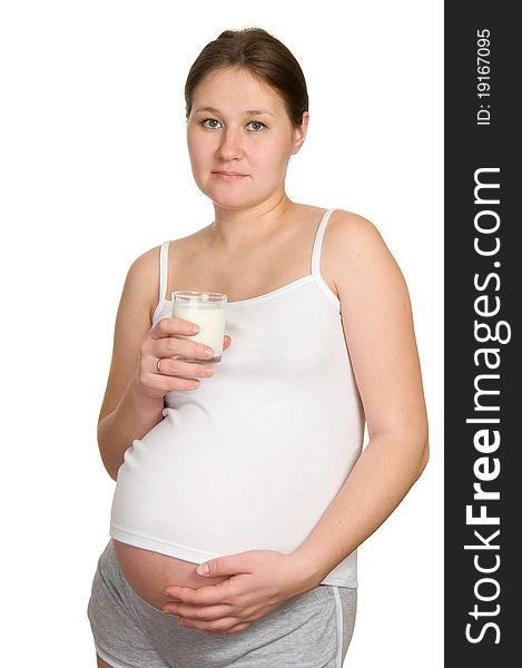 Pregnant woman with glass of milk over white. Pregnant woman with glass of milk over white