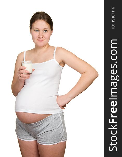 Adorable pregnant woman with milk over white. Adorable pregnant woman with milk over white