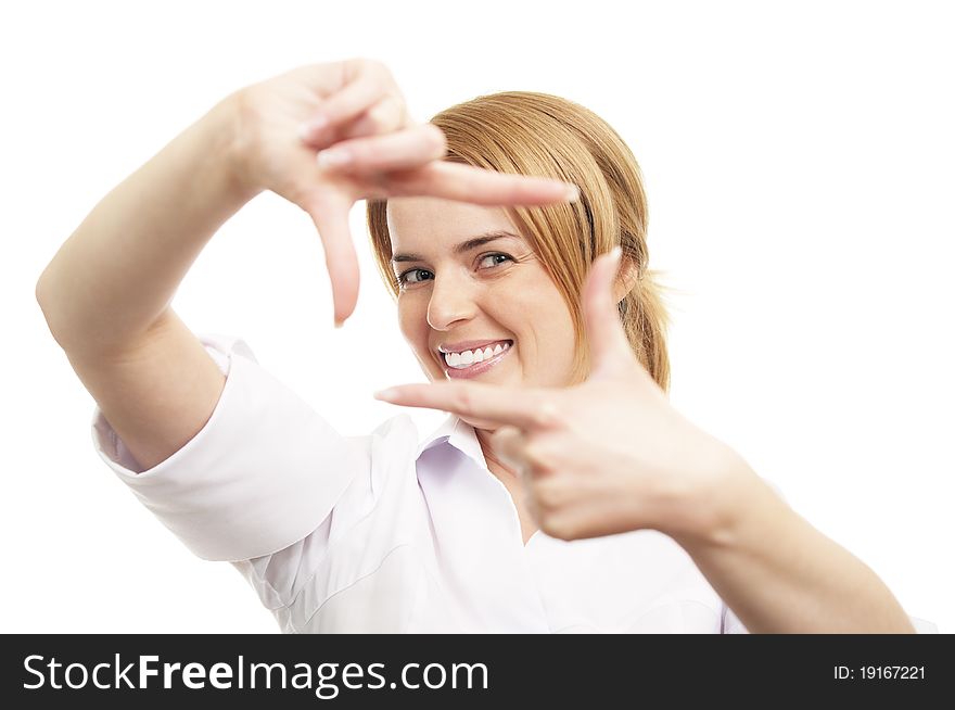 Young woman looking through the fingers