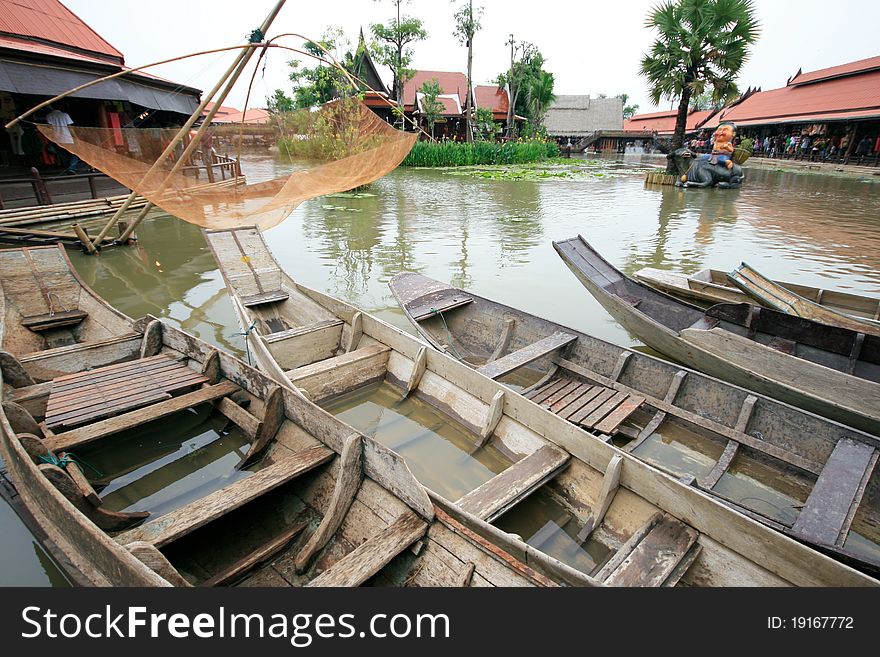 Boat along the water park. The Floating Market Ayodhya. One of the attractions of Thailand.