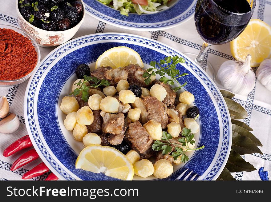 Close up view of a dish of fried meat with potatoes typical of Alentejo cuisine. Close up view of a dish of fried meat with potatoes typical of Alentejo cuisine.