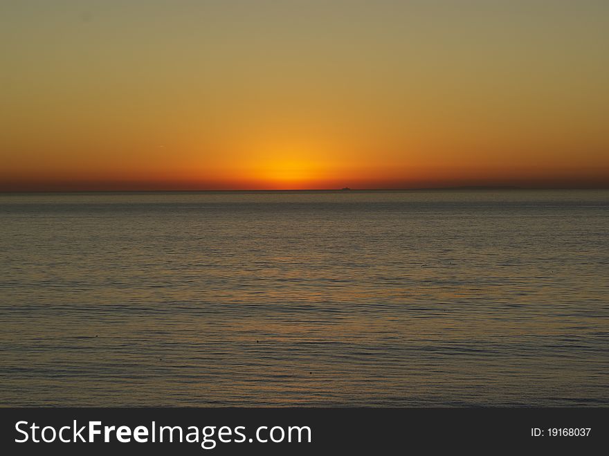 Sunset over water of Pacific Ocean with glow. Sunset over water of Pacific Ocean with glow