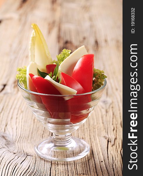 Raw vegetables in a glass dish. Raw vegetables in a glass dish