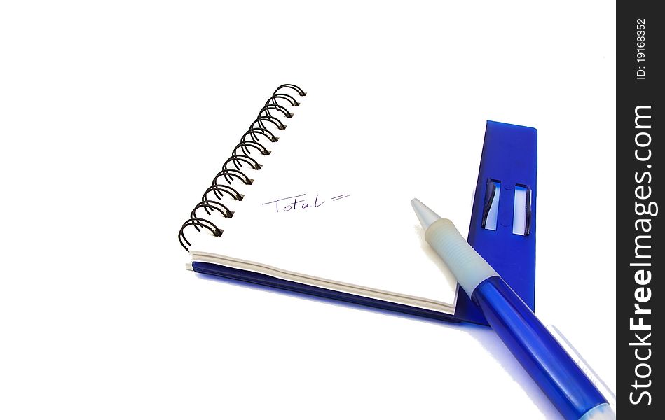 A notebook and a blue pen isolated on white background. A notebook and a blue pen isolated on white background