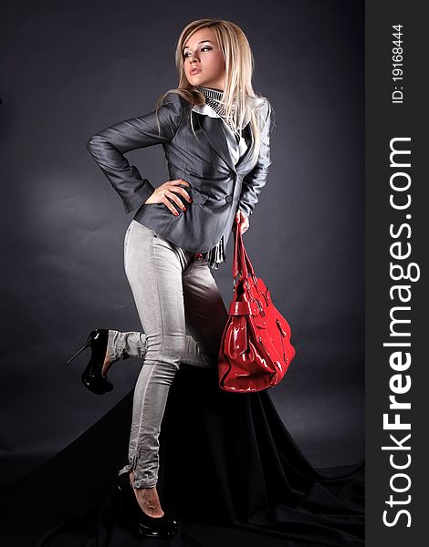 Fashion young woman with red bag