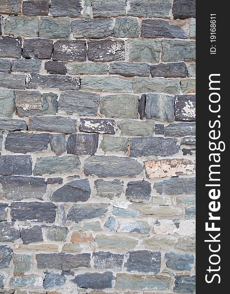 Old stone wall, flat stacked background and texture. Old stone wall, flat stacked background and texture.