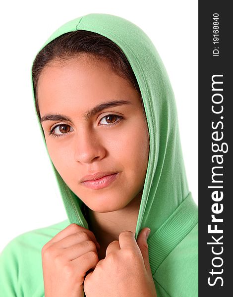 Beautiful woman with a green coat on her head over white background