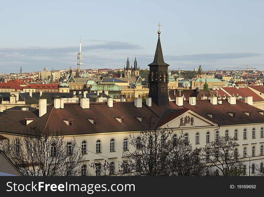 Prague rooftops view from the Prague Castle area (Looking south-east from Prague.) In view: Žižkov television tower, Church of Our Lady before Týn (Týnský chrám), towers of Old Town city hall. Prague rooftops view from the Prague Castle area (Looking south-east from Prague.) In view: Žižkov television tower, Church of Our Lady before Týn (Týnský chrám), towers of Old Town city hall.