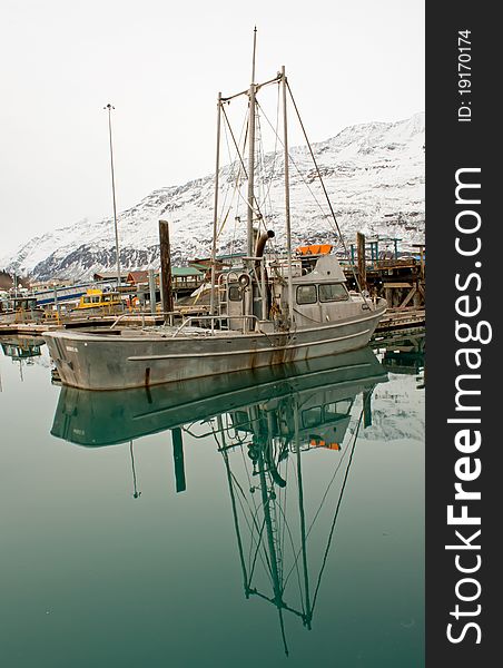 Boat docked on still waters