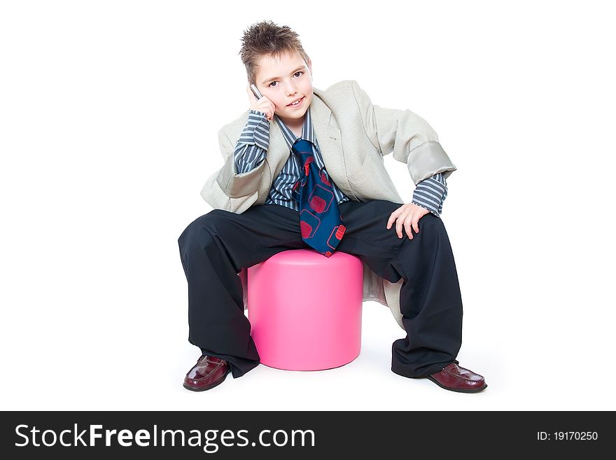 Child as a business man talking on the phone. Child as a business man talking on the phone