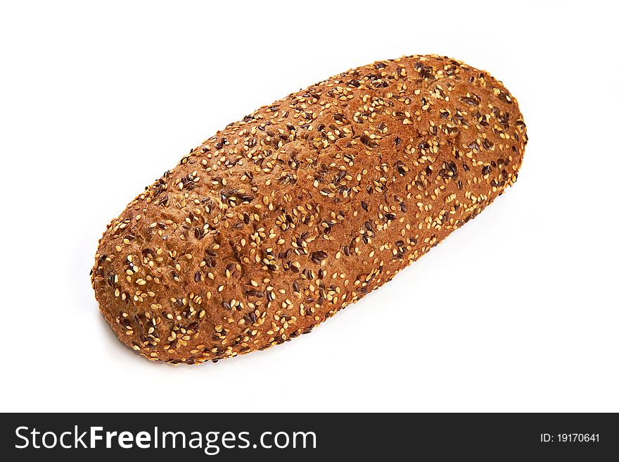 Loaf of rye bread with seeds isolated on white background