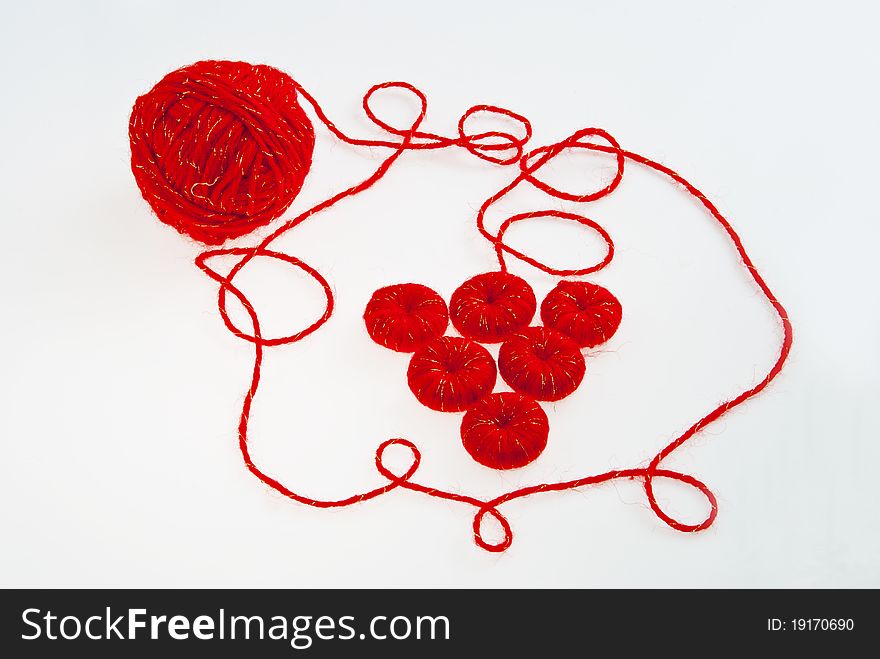 Stylized bunch of grapes in red thread. Stylized bunch of grapes in red thread.