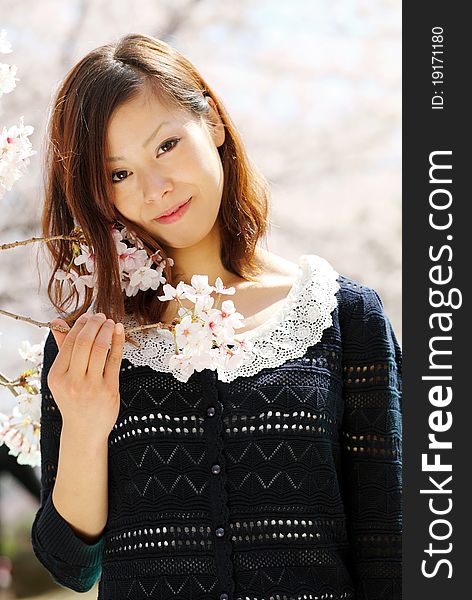 Portrait of young japanese woman in the spring garden. Portrait of young japanese woman in the spring garden