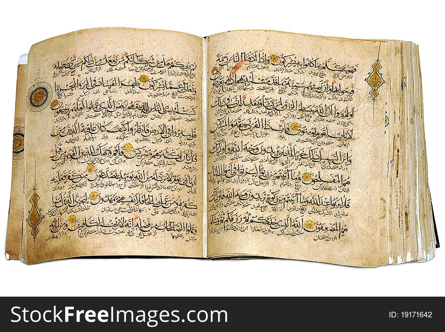 Holy Islamic old book Koran opened and isolated