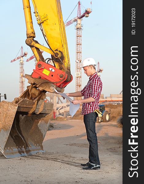 Young architect working outdoors on a construction site