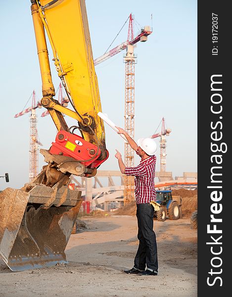 Architect Working Outdoors On A Construction Site