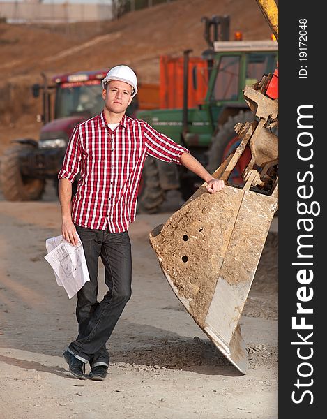 Young architect working outdoors on a construction site