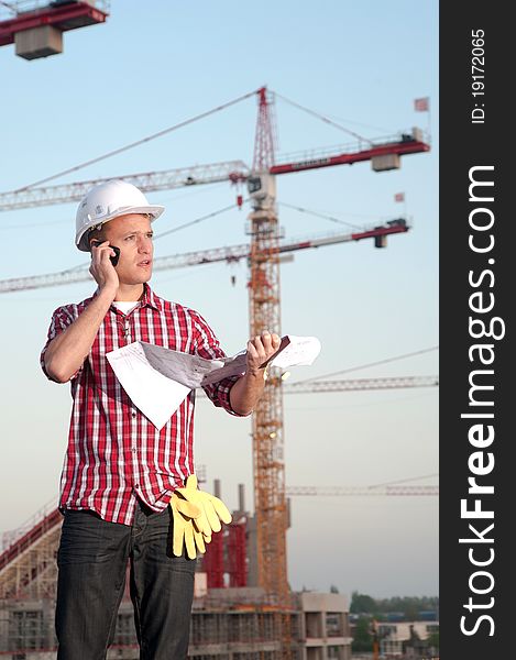 Young architect working outdoors on a construction site