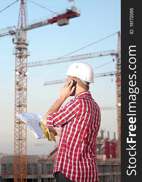 Young architect working outdoors on a construction site