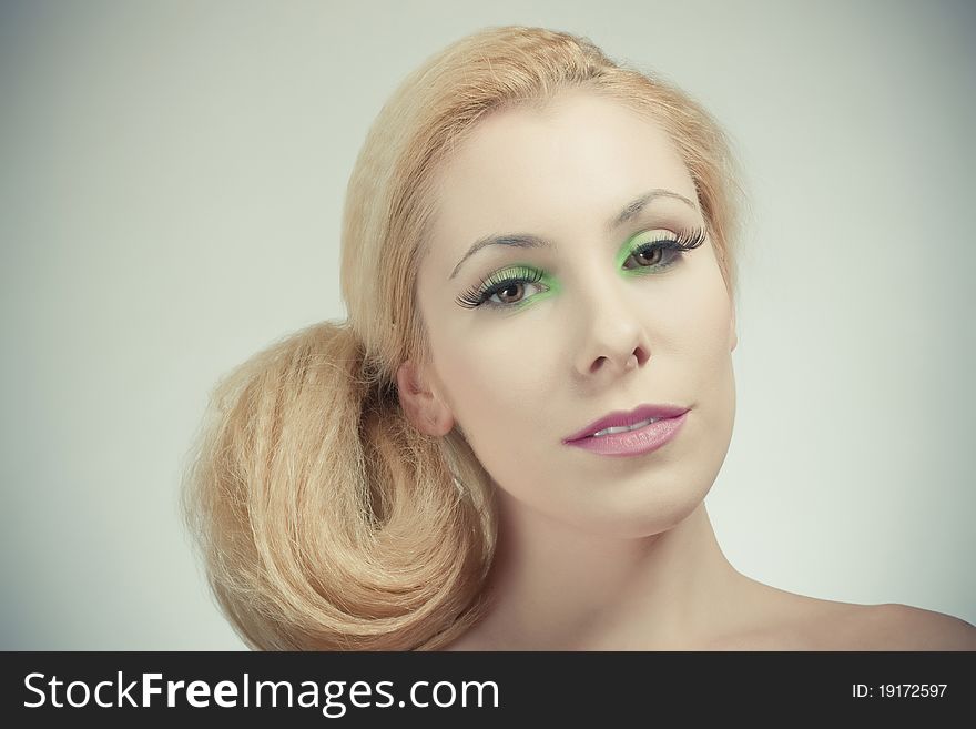 Beautiful blond girl, joyful color makeup