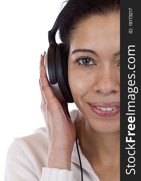 Close-up of a happy woman enjoying with headphones music. Isolated on white background. Close-up of a happy woman enjoying with headphones music. Isolated on white background.