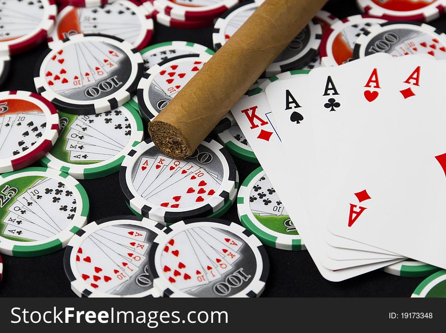 Poker of aces, chips and a cigar