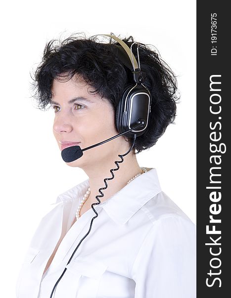 Telemarketer with headphones, she wears white blouse