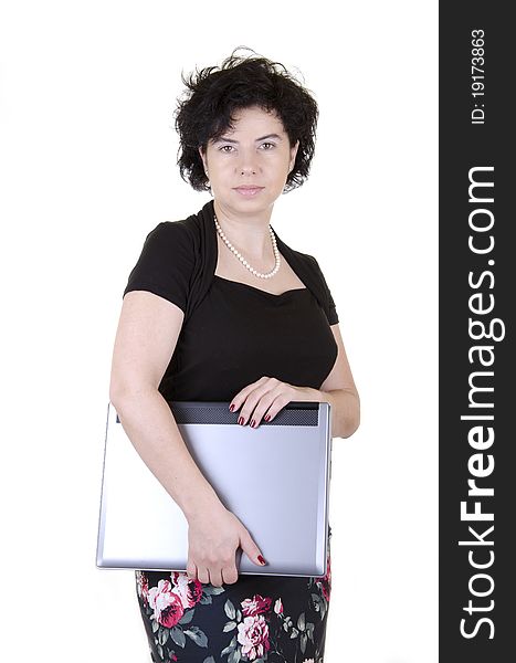 Businesswoman in a black blouse and colorful skirt with laptop. Businesswoman in a black blouse and colorful skirt with laptop