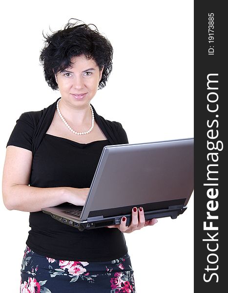 Happy and smiling businesswoman in black shirt and colorful skirt with laptop. Happy and smiling businesswoman in black shirt and colorful skirt with laptop