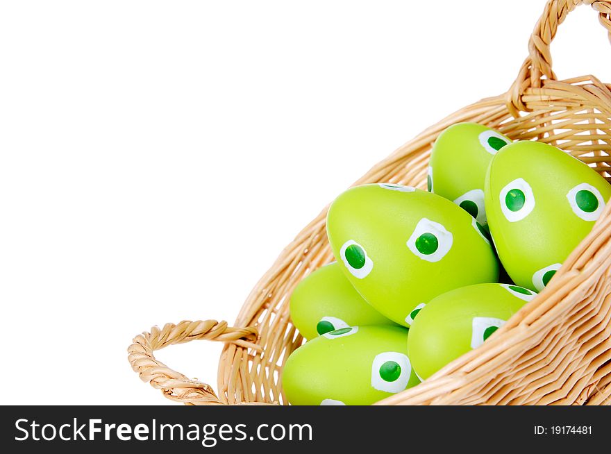 Eggs in the green Easter basket. Painted eggs