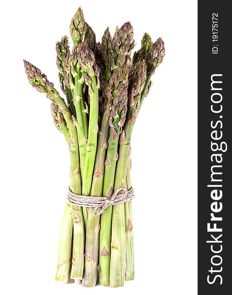 A bunch of green asparagus in front of white background