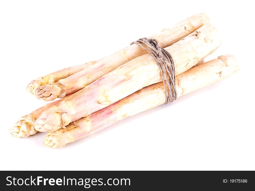 A bunch of white asparagus in front of white background