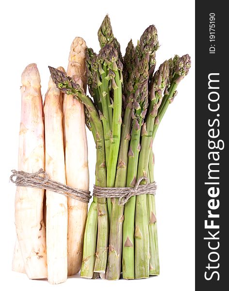 A bunch of green and white asparagus in front of white background