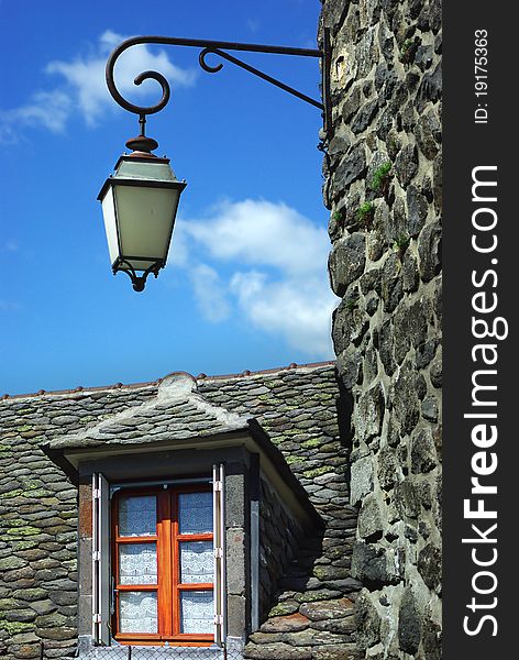 On the photo:Old traditional French house with lantern. Salers. On the photo:Old traditional French house with lantern. Salers