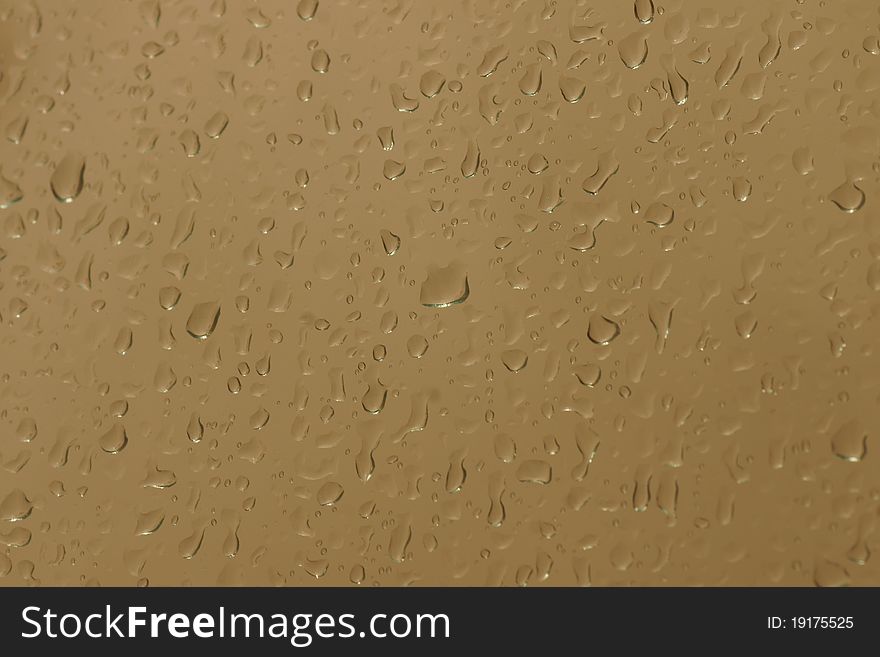 Background of water droplets on yellow reflective surface. Background of water droplets on yellow reflective surface