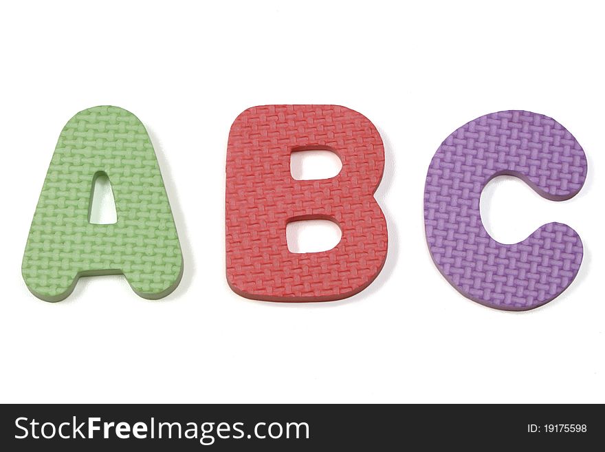 Colorful abc foam letters on a white background. Colorful abc foam letters on a white background