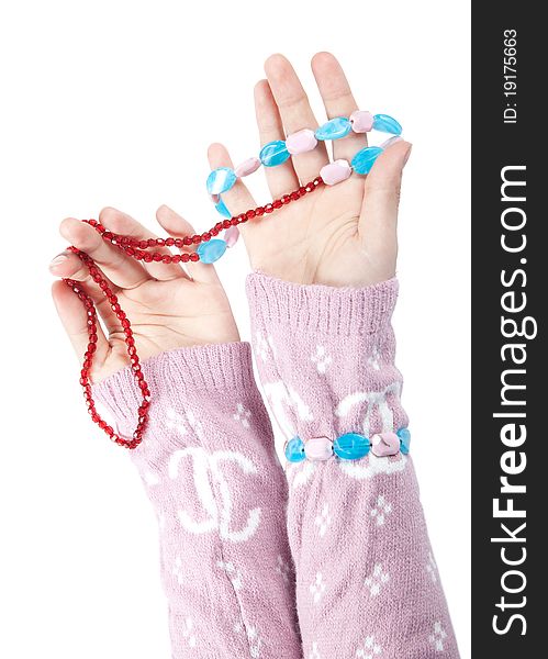 The hands of girls showing glass ornaments isolated on white with clipping path