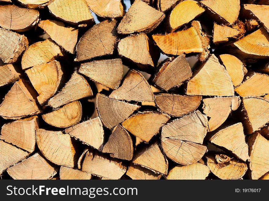 Stack of firewood chunks background. Stack of firewood chunks background