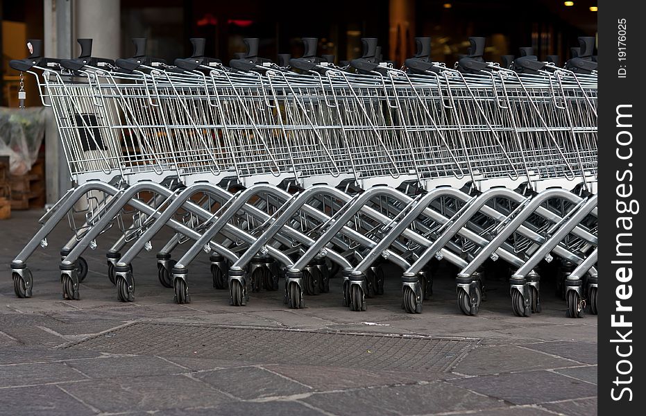 Shopping carts in a row in front of a mall