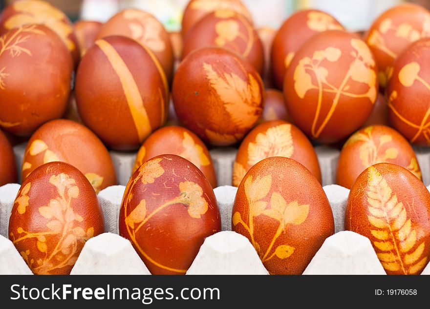 Brown eggs with herbal ornaments on a market. Brown eggs with herbal ornaments on a market