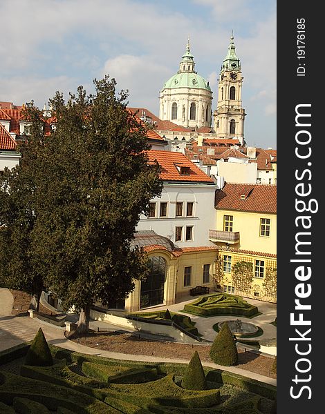 The spires of st. Nicholas church seen from Vrtbovska garden in Prague, Czech Republic.